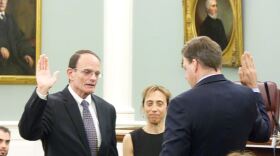 A photograph of former N.H. Supreme Court Justice Bob Lynn being sworn in by Gov. Chris Sununu in 2018. 