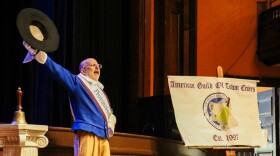 Provincetown town crier Daniel Gómez Llata speaks to the audience inside Town Hall during the Town Crier Competition.