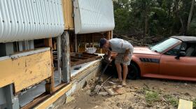 Rick Conflitti surveys the damage at his home in Charlotte Harbor, Fla., on Thursday, hours after Hurricane Milton made landfall nearly 50 miles north.