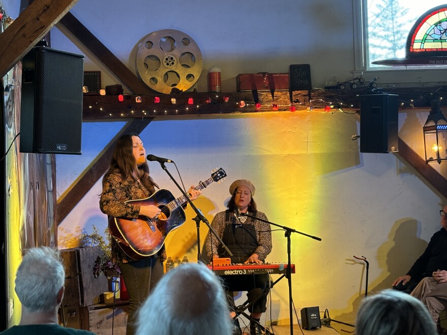 Caroline Spence with Clare Reynolds on stage at The Word Barn in Exeter, NH May 3, 2024